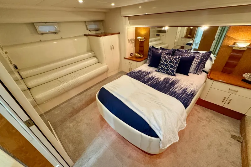 Slide: The Image of Luxurious bedroom in 1995 Queenship 62 Pilothouse Motor Yacht with elegant decor and plush bedding. - 32