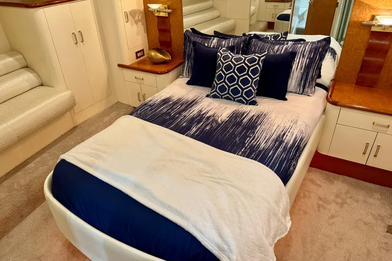 Slide: The Image of Luxurious bedroom interior of 1995 Queenship 62 Pilothouse Motor Yacht with elegant bedding. - 33