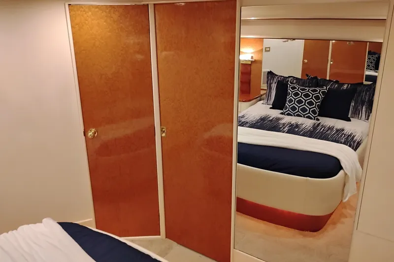 Slide: The Image of Luxurious bedroom interior of 1995 Queenship 62 Pilothouse Motor Yacht with elegant bedding. - 34