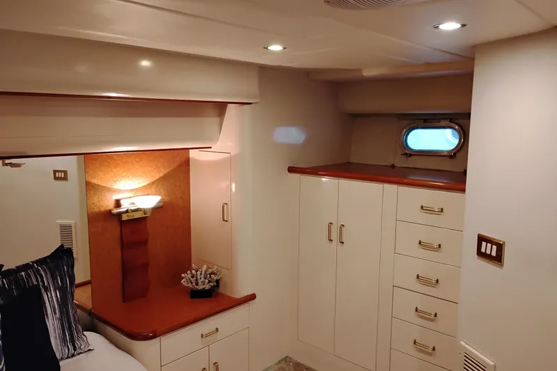 Slide: The Image of Luxurious interior of 1995 Queenship 62 Pilothouse Motor Yacht cabin with elegant cabinetry. - 36