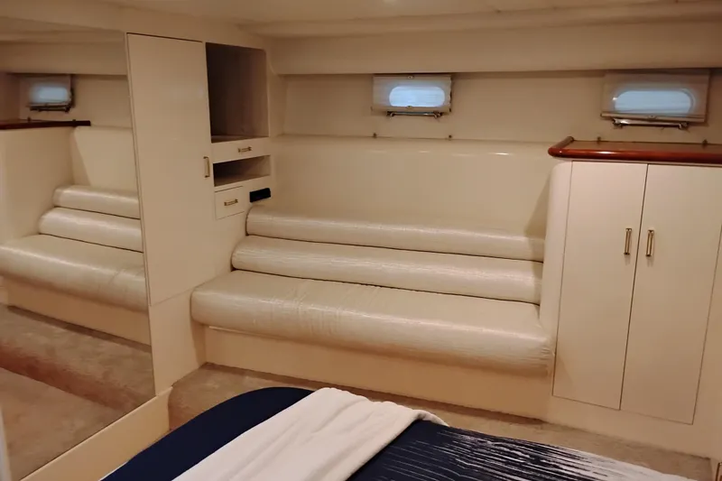 Slide: The Image of Luxurious interior of 1995 Queenship 62 Pilothouse Motor Yacht with elegant seating and cabinetry. - 37