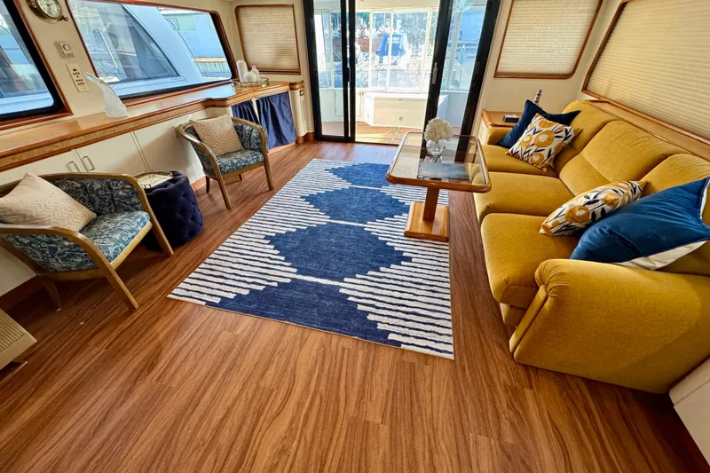 Slide: The Image of Luxurious 1995 Queenship 62 Pilothouse Motor Yacht interior with elegant seating and decor. - 4