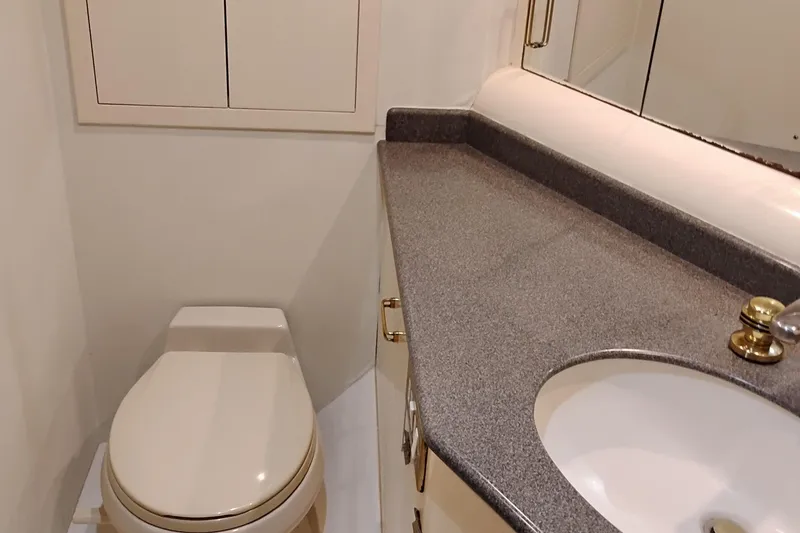 Slide: The Image of Luxurious bathroom in 1995 Queenship 62 Pilothouse Motor Yacht with modern fixtures. - 46