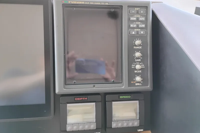 Slide: The Image of Control panel of a 1995 Queenship 62 Pilothouse Motor Yacht with Furuno display. - 55