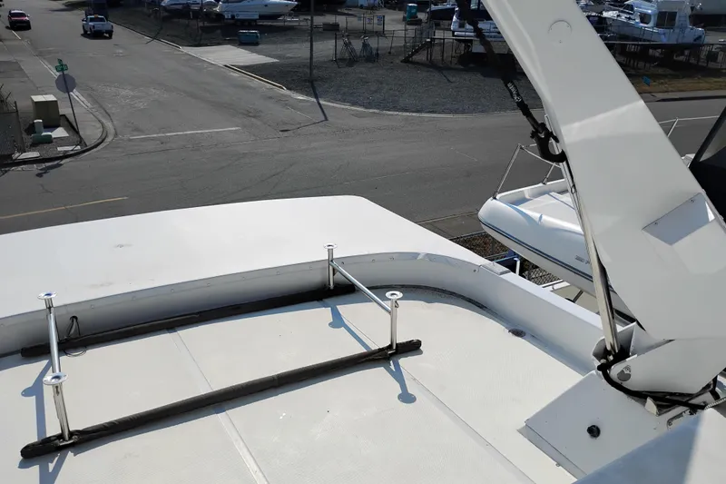 Slide: The Image of 1995 Queenship 62 Pilothouse Motor Yacht deck view at marina. - 58