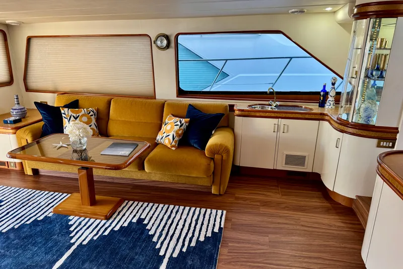 Slide: The Image of Luxurious 1995 Queenship 62 Pilothouse Motor Yacht interior with elegant seating and decor. - 6