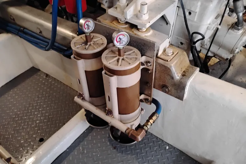 Slide: The Image of Engine room components of a 1995 Queenship 62 Pilothouse Motor Yacht. - 66