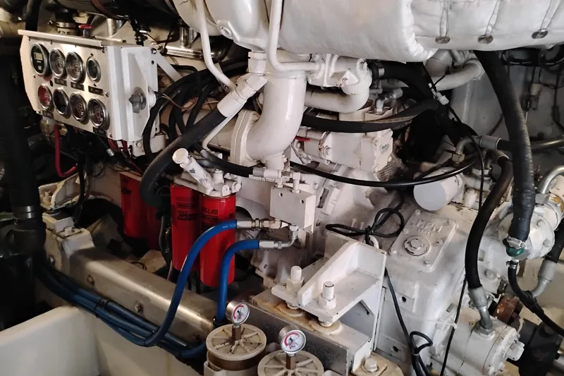 Slide: The Image of Engine room of 1995 Queenship 62 Pilothouse Motor Yacht with gauges and wiring. - 67