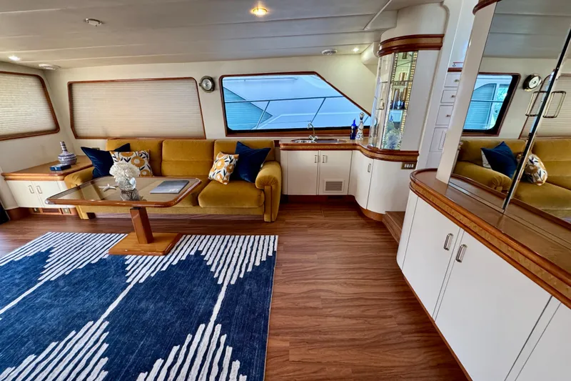 Slide: The Image of Luxurious interior of 1995 Queenship 62 Pilothouse Motor Yacht with elegant seating and decor. - 7