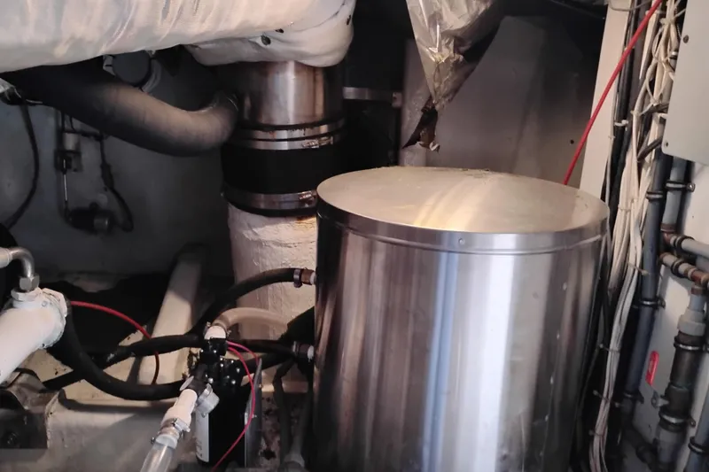 Slide: The Image of Engine room of 1995 Queenship 62 Pilothouse Motor Yacht with mechanical components. - 71