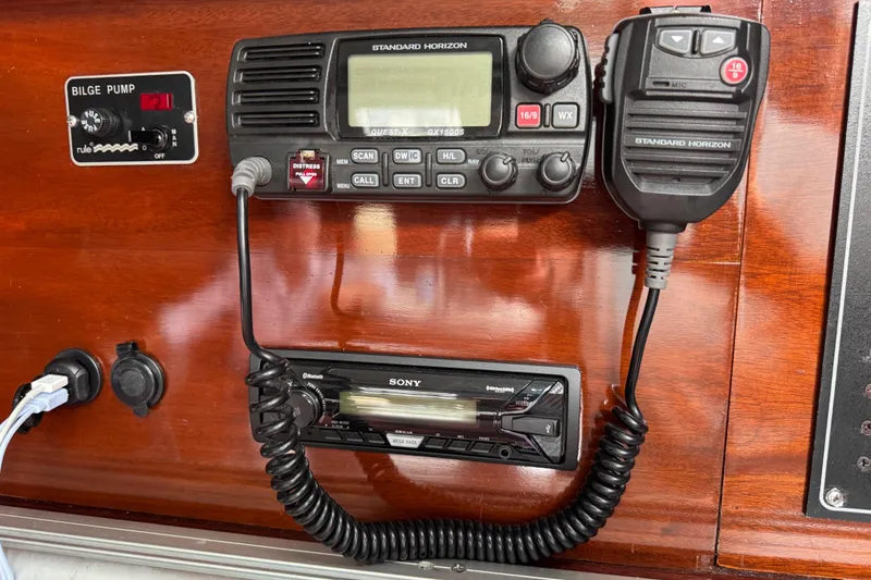 Slide: The Image of Control panel of a 1989 Beneteau First 41s5 with radio and bilge pump switch. - 26