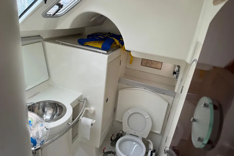 Slide: The Image of Beneteau First 41s5 1989 yacht bathroom with sink, toilet, and storage. - 29