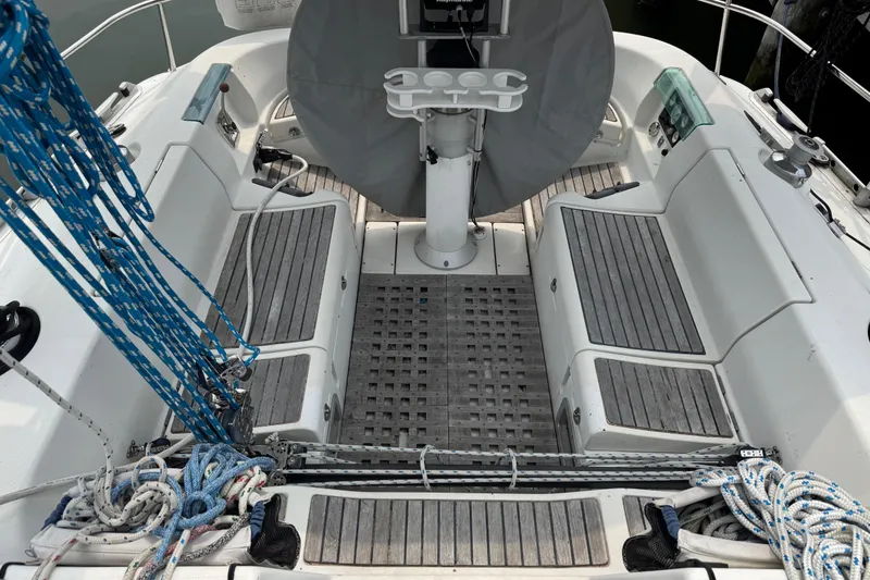 Slide: The Image of Cockpit of 1989 Beneteau First 41s5 sailboat with seating and rigging. - 18