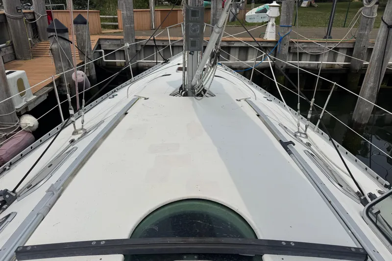 Slide: The Image of Deck view of 1989 Beneteau First 41s5 sailboat docked at marina. - 9