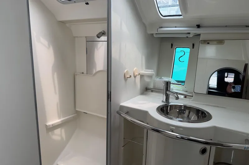 Slide: The Image of Bathroom interior of 1989 Beneteau First 41s5 yacht with sink and shower. - 28