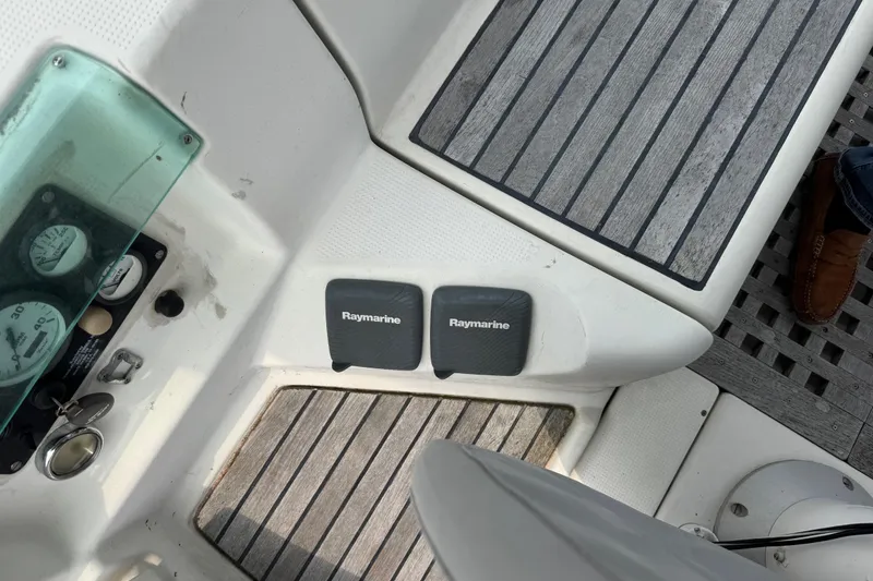 Slide: The Image of Cockpit of 1989 Beneteau First 41s5 with Raymarine equipment and wooden flooring. - 20