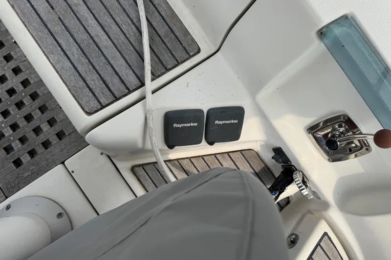 Slide: The Image of Cockpit of 1989 Beneteau First 41s5 with Raymarine equipment and wooden flooring. - 19
