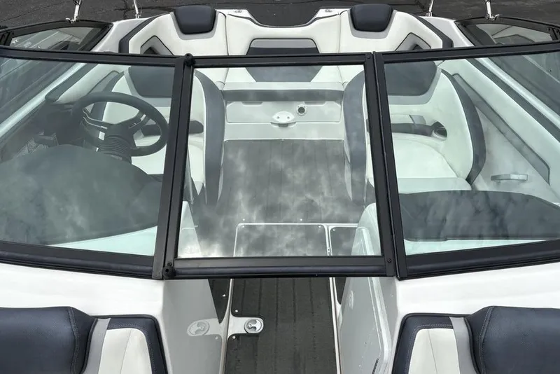 Slide: The Image of 2017 Yamaha Boats SX195 interior with sleek seating and modern steering wheel design. - 10