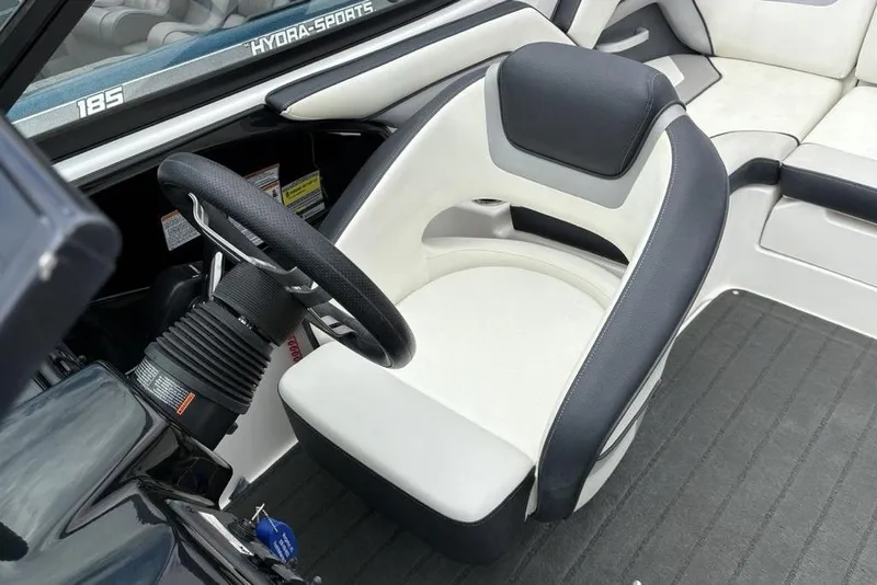 Slide: The Image of 2017 Yamaha Boats SX195 interior with steering wheel and seating. - 15