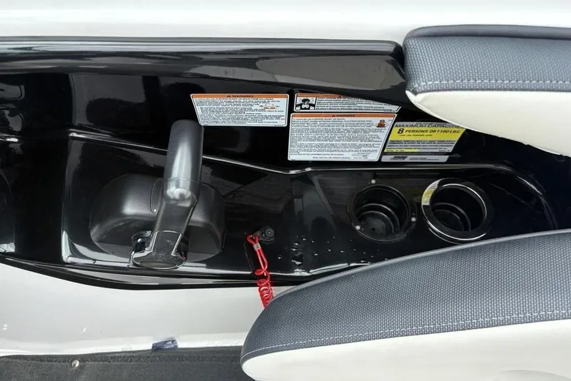 Slide: The Image of 2017 Yamaha Boats SX195 dashboard with throttle, cup holders, and safety warnings. - 17