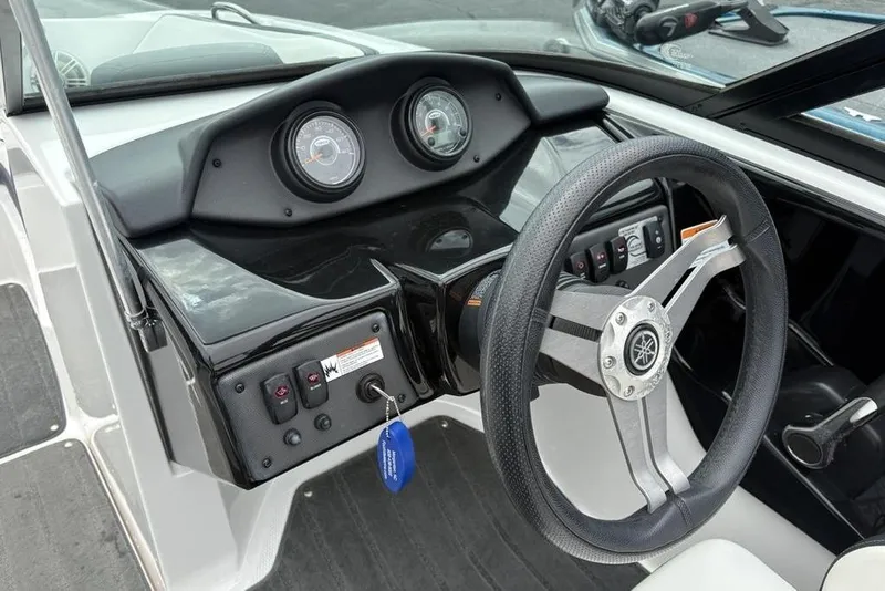 Slide: The Image of 2017 Yamaha Boats SX195 dashboard with steering wheel and instrument panel. - 22