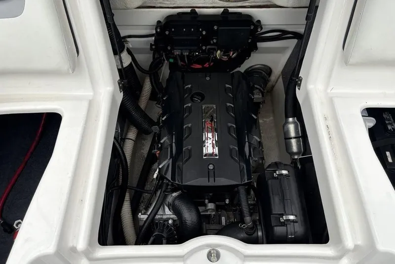 Slide: The Image of 2017 Yamaha Boats SX195 engine compartment with visible components and wiring. - 23