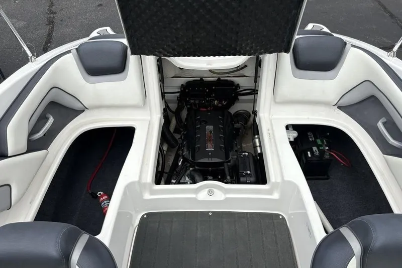 Slide: The Image of 2017 Yamaha Boats SX195 engine compartment with open hatch, showcasing interior components. - 24