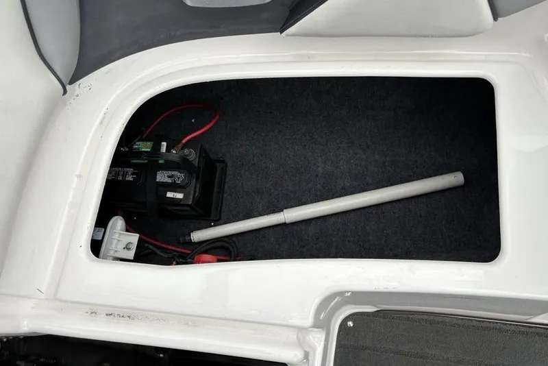 Slide: The Image of 2017 Yamaha SX195 boat storage compartment with battery and equipment. - 25