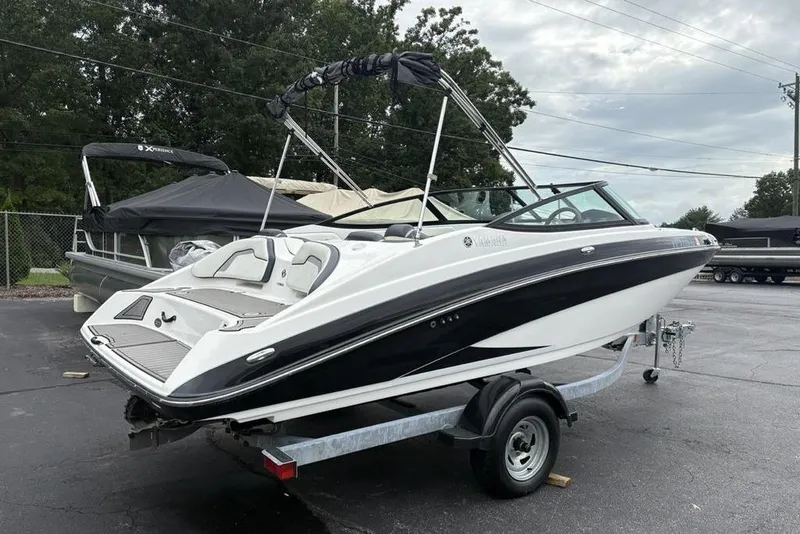 Slide: The Image of 2017 Yamaha Boats SX195 on trailer, parked outdoors, with overcast sky. - 3