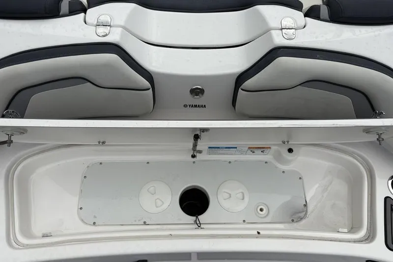 Slide: The Image of 2017 Yamaha Boats SX195 interior storage compartment with seating detail. - 31