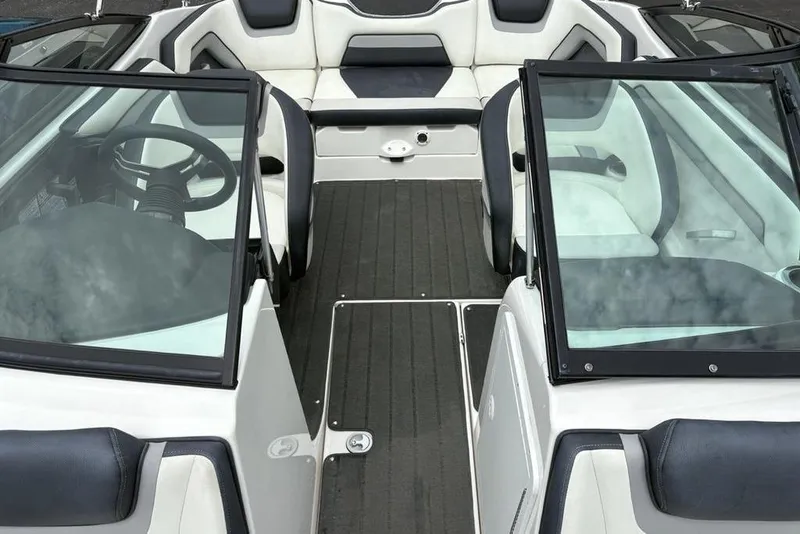 Slide: The Image of 2017 Yamaha Boats SX195 interior with sleek seating and modern dashboard design. - 9