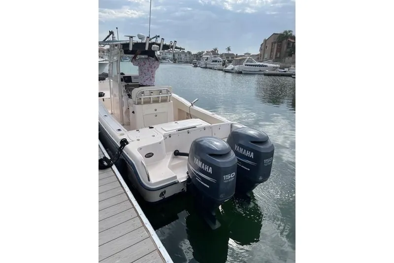 Slide: The Image of 2005 Grady-White Advance 257 boat on trailer in parking lot. - 1