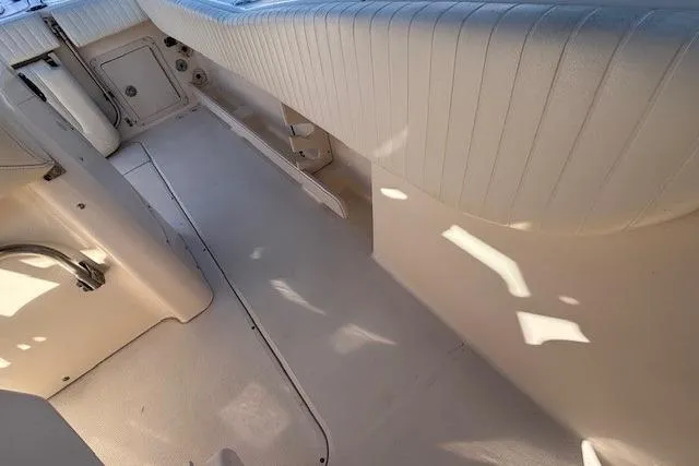 Slide: The Image of 2005 Grady-White Advance 257 boat, center console, docked in a marina. - 10