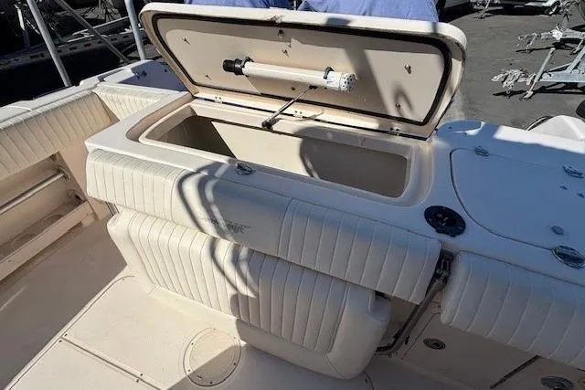 Slide: The Image of 2005 Grady-White Advance 257 boat interior with white seating and clean deck. - 12