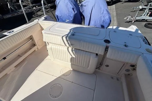 Slide: The Image of 2005 Grady-White Advance 257 boat interior with open storage compartments. - 14