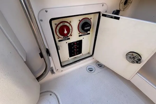 Slide: The Image of 2005 Grady-White Advance 257 boat interior with seating and storage compartments. - 16