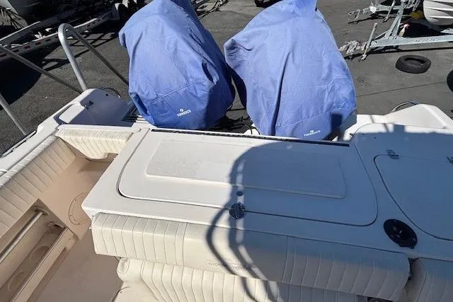 Slide: The Image of Control panel inside a 2005 Grady-White Advance 257 boat, featuring switches and dials. - 17