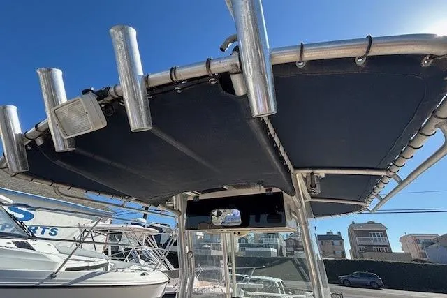 Slide: The Image of 2005 Grady-White Advance 257 boat console with steering wheel and controls. - 19