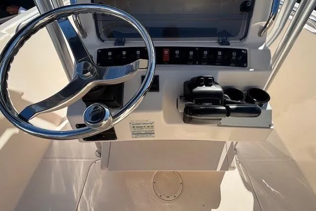 Slide: The Image of 2005 Grady-White Advance 257 boat with T-top, docked in a marina. - 21