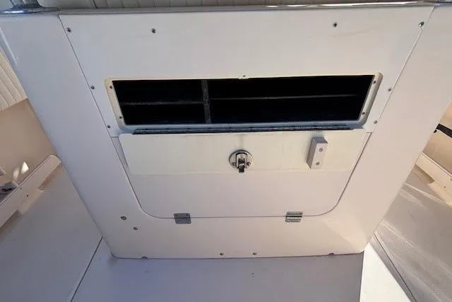 Slide: The Image of 2005 Grady-White Advance 257 boat storage compartment with open hatch. - 24