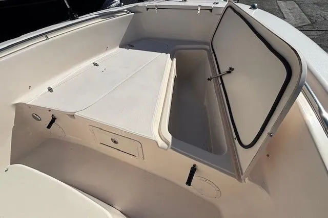 Slide: The Image of 2005 Grady-White Advance 257 boat interior, featuring spacious seating and storage. - 5