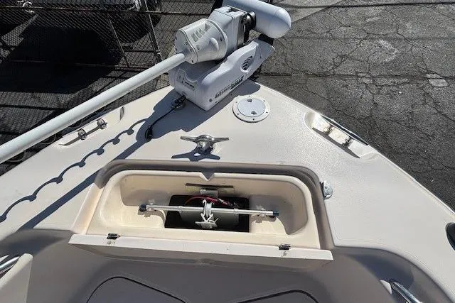 Slide: The Image of 2005 Grady-White Advance 257 boat storage compartments open, showcasing spacious interior. - 7