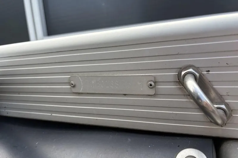 Slide: The Image of 2015 Bennington 24 S Series boat identification plate and handle detail. - 30