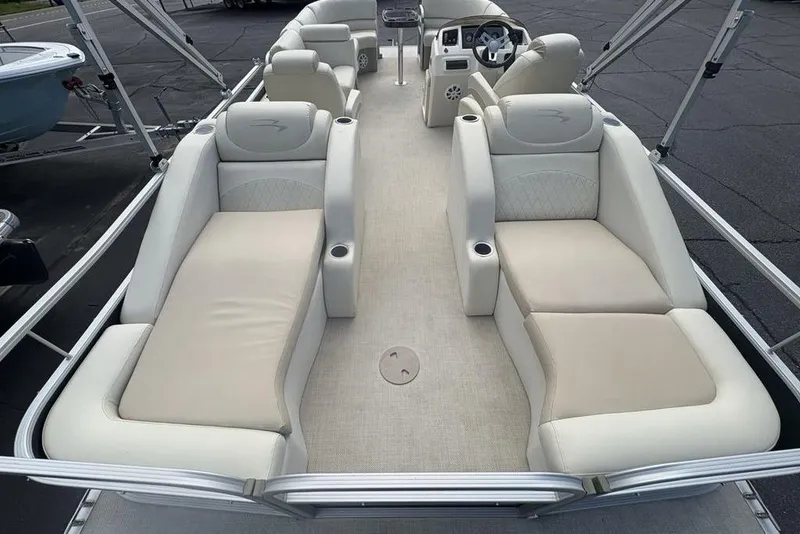 Slide: The Image of 2015 Bennington 24 S Series pontoon boat with spacious seating and modern interior design. - 33