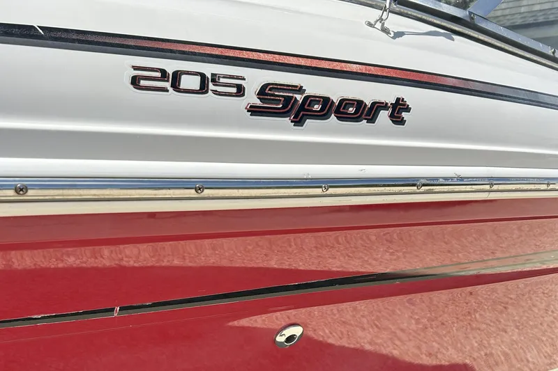 Slide: The Image of 2007 Sea Ray 205 Sport boat, red and white exterior with model name displayed. - 10