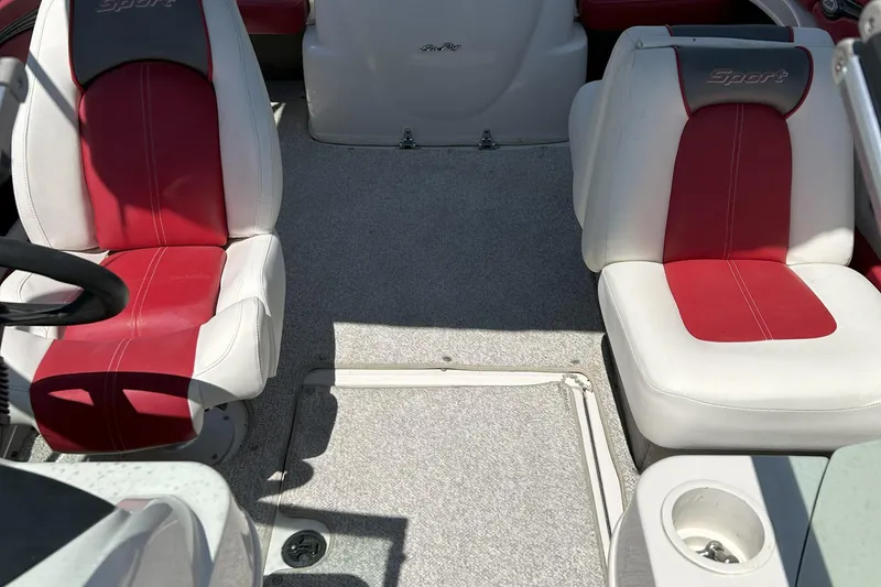 Slide: The Image of 2007 Sea Ray 205 Sport boat interior with red and white seating. - 2