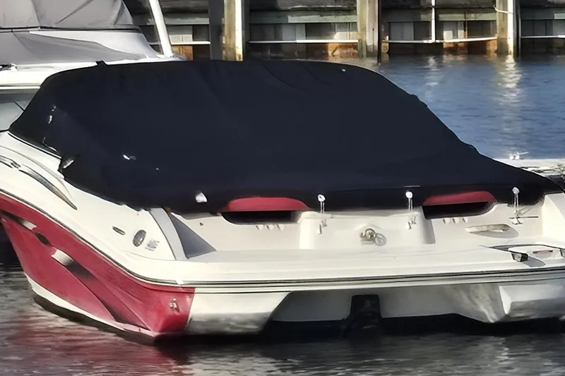 Slide: The Image of 2007 Sea Ray 205 Sport boat with cover, docked in marina. - 7