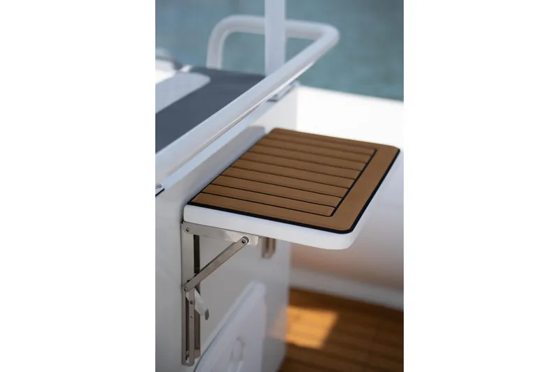 Slide: The Image of Foldable wooden table on 2026 Tide Craft Galveston 19 boat, showcasing sleek design. - 11
