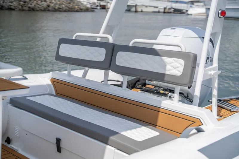 Slide: The Image of 2026 Tide Craft Galveston 19 boat interior with cushioned seating and modern design. - 7