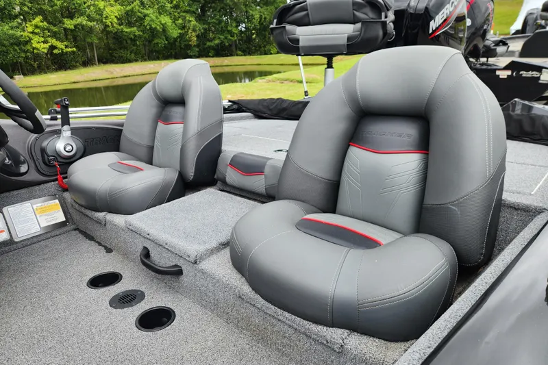 Slide: The Image of 2023 Tracker Pro Team 190 TX boat interior with gray cushioned seats. - 12